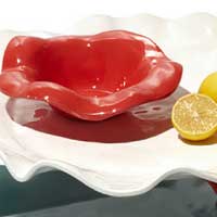 Beatriz Ball luxury melamine pieces in red, white, and aqua 